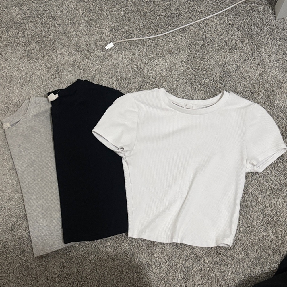 garage black, white, and grey tees